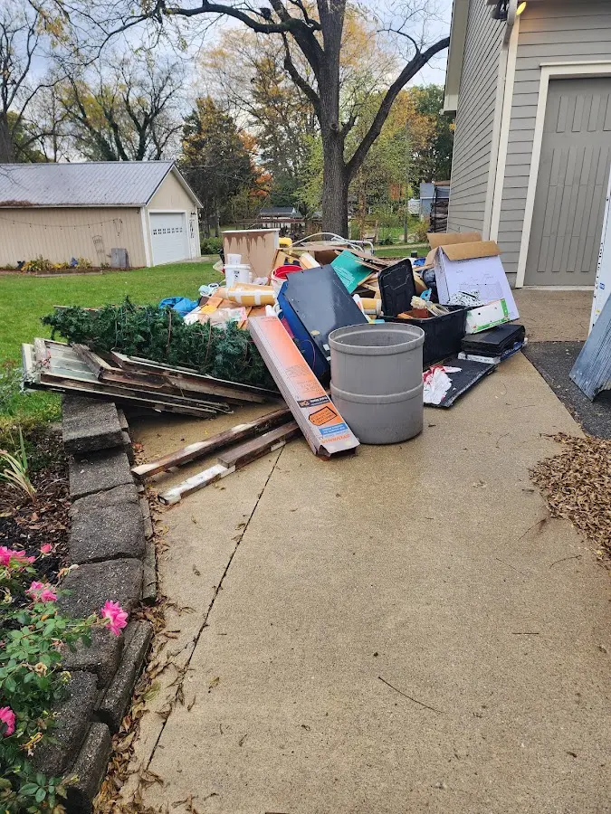 Dumpster being loaded with debris for 30 Yard Dumpster Rental in Spurgeon